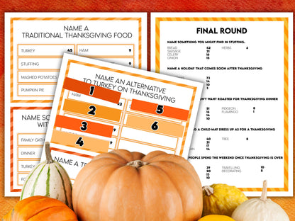 A collection of printable Thanksgiving Friendly Feud game sheets with orange and white color theme, along with a pumpkin and turkey decoration.