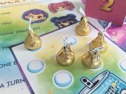 Gold Hershey kisses on a candy dice demon hunter game board