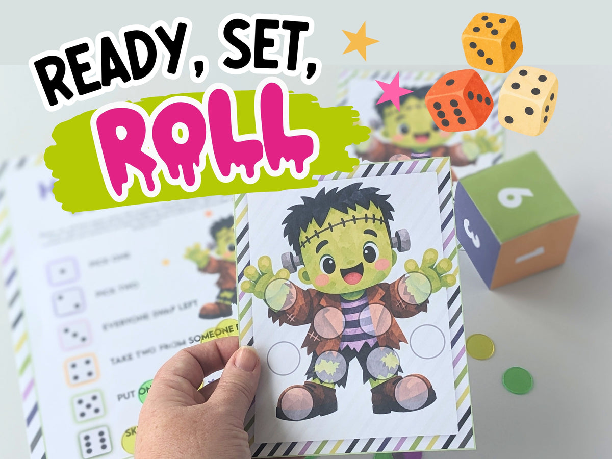 A hand holds a printable dice based Halloween activity sheet featuring a cartoon Frankenstein character, with other matching sheets and colorful dice in the background. Large text at the top reads “READY, SET, ROLL.
