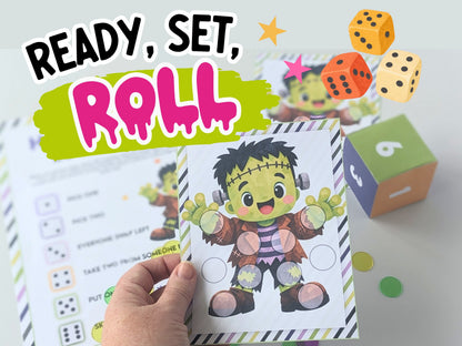 A hand holds a printable dice based Halloween activity sheet featuring a cartoon Frankenstein character, with other matching sheets and colorful dice in the background. Large text at the top reads “READY, SET, ROLL.